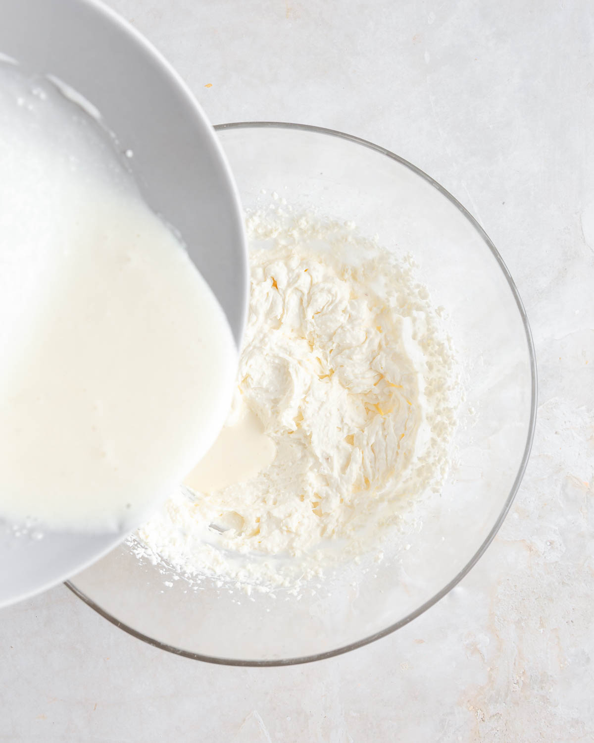 Gelatin being added to whipped cream.
