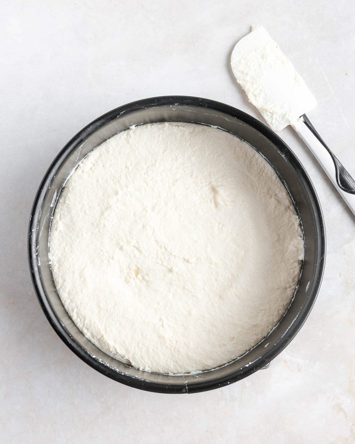 Cream cheese mixture in a baking pan.