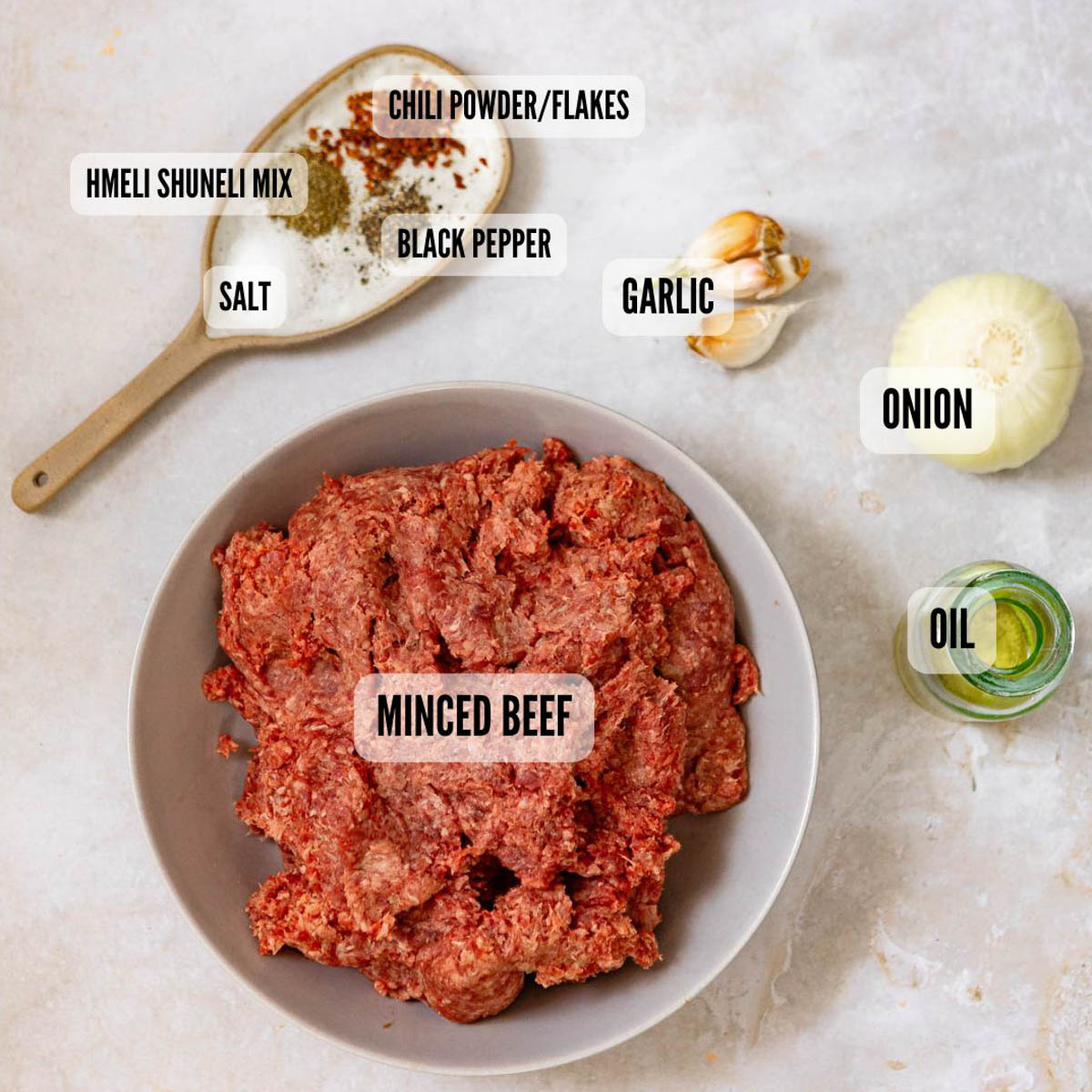 Labeled shot of beef kebab aka koobideh ingredients.