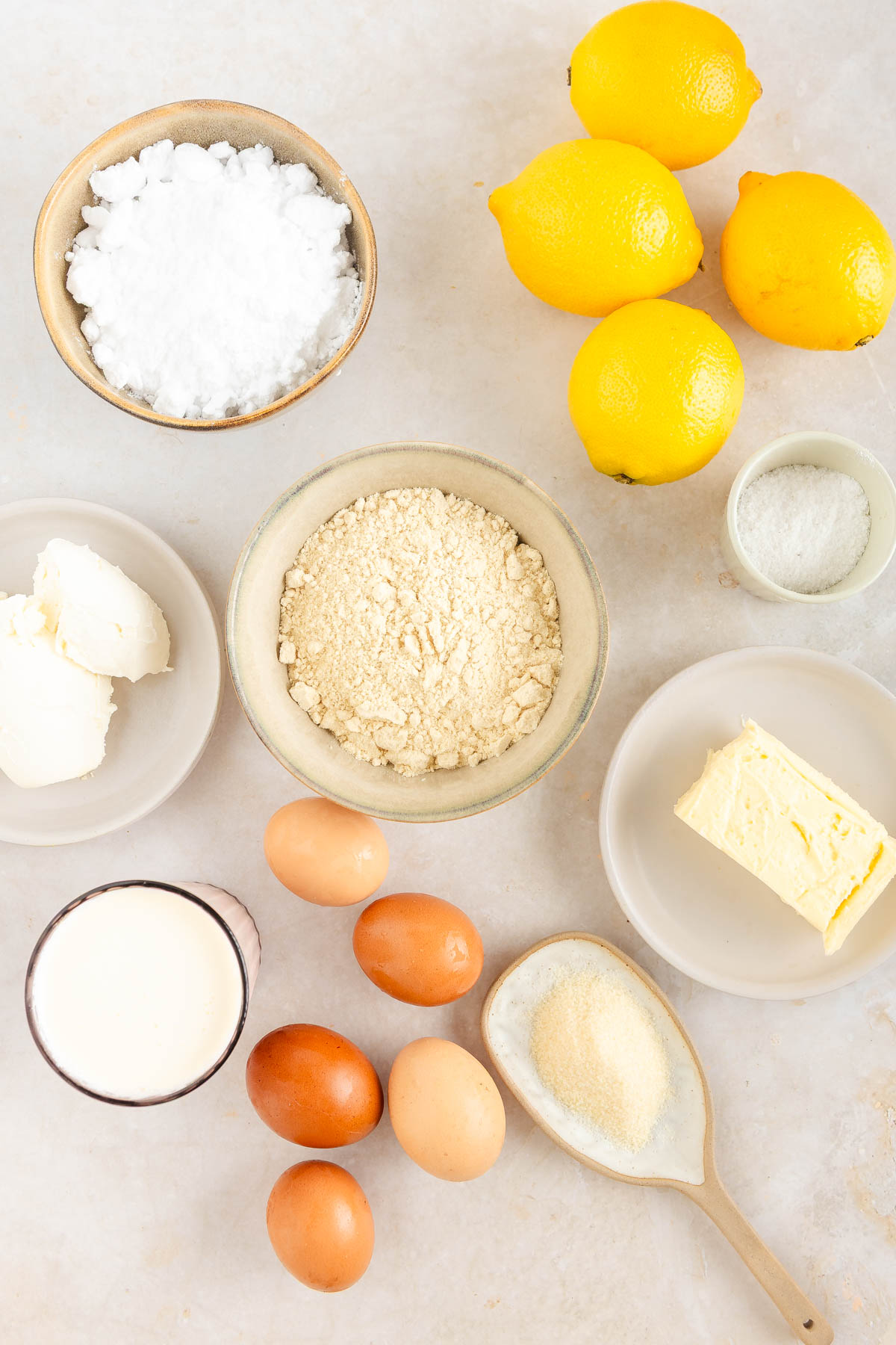 Lemon mousse tart ingredients on a light background.