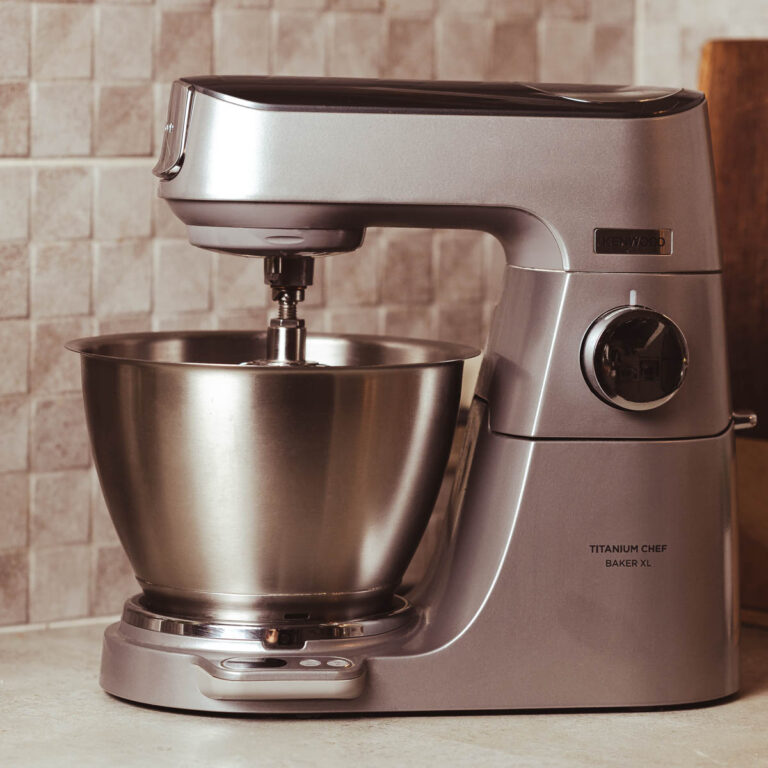 Kenwood Titanium Baker Chef XL on a gray kitchen countertop.