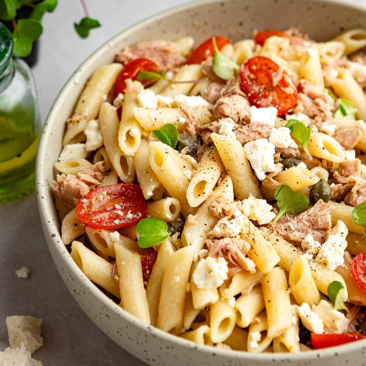 A closeup shot of pasta tuna salad bowl with ricotta cheese.
