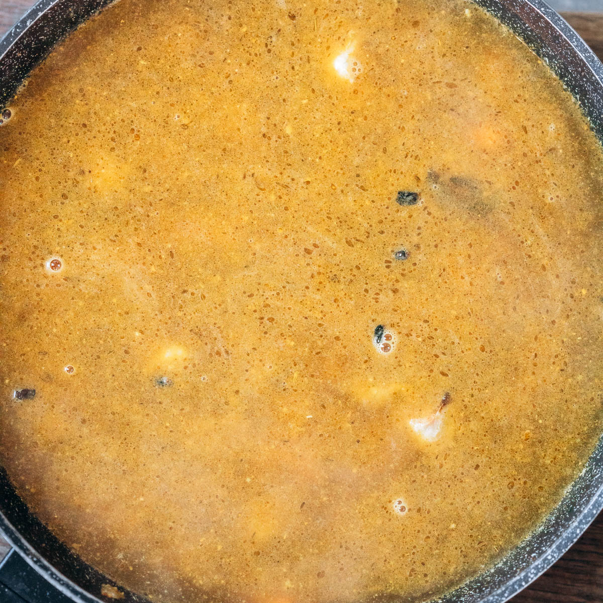 Pilaf being cooked in a skillet.